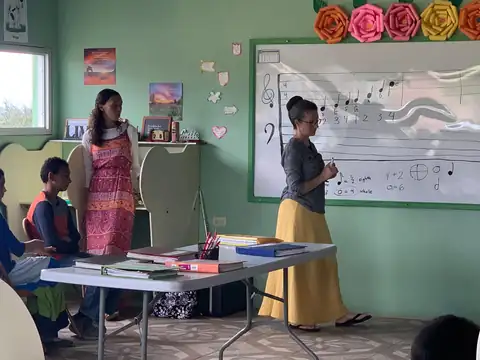A teacher at the whiteboard during a lesson in one of the classrooms
