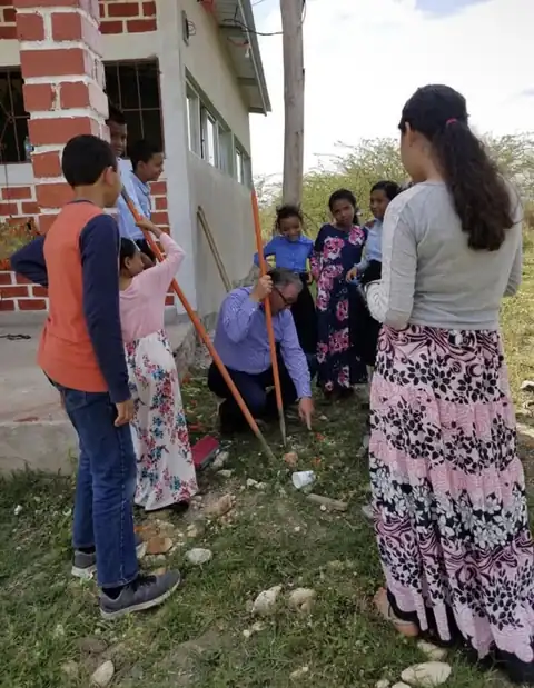 Bro. Finnicum with children outside the church in Talanga